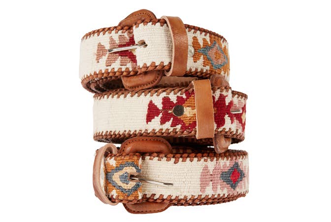 Handcrafted Guatemalan leather belts in vibrant colors with bohemian-inspired designs, perfect for adding a pop of style to any look.